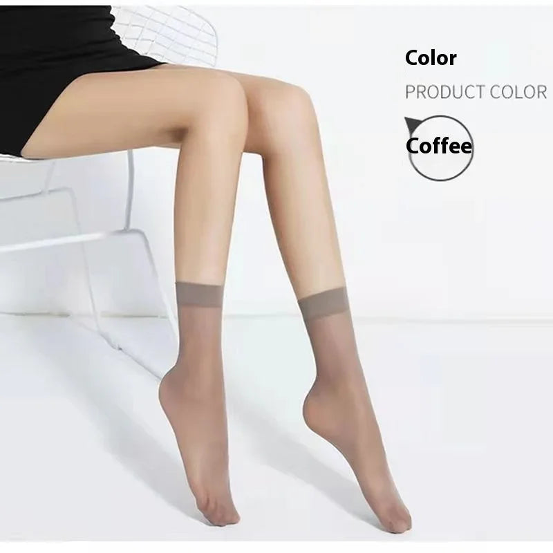 Woman wearing coffee color sheer ankle hosiery sitting on white wire chair in minimal studio