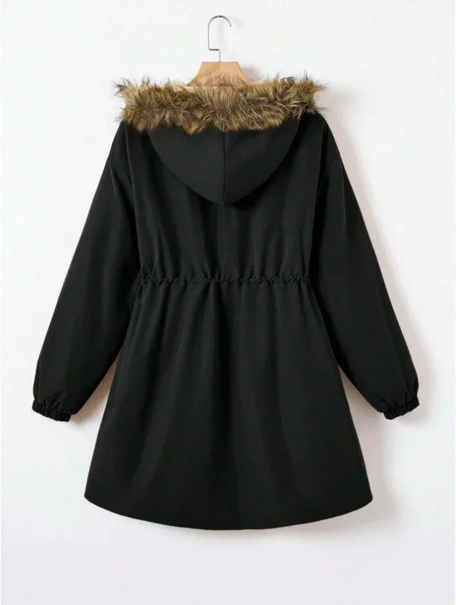 Back view of black hooded winter coat with brown faux fur trim and elastic waist on hanger