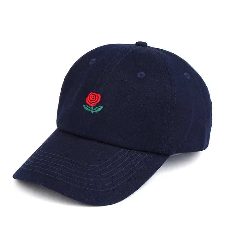 Navy blue baseball cap with embroidered red rose and green leaves on front