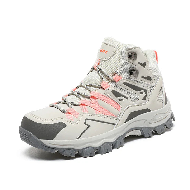 Light gray hiking boot with pink laces, rugged gray outsole, and breathable mesh upper