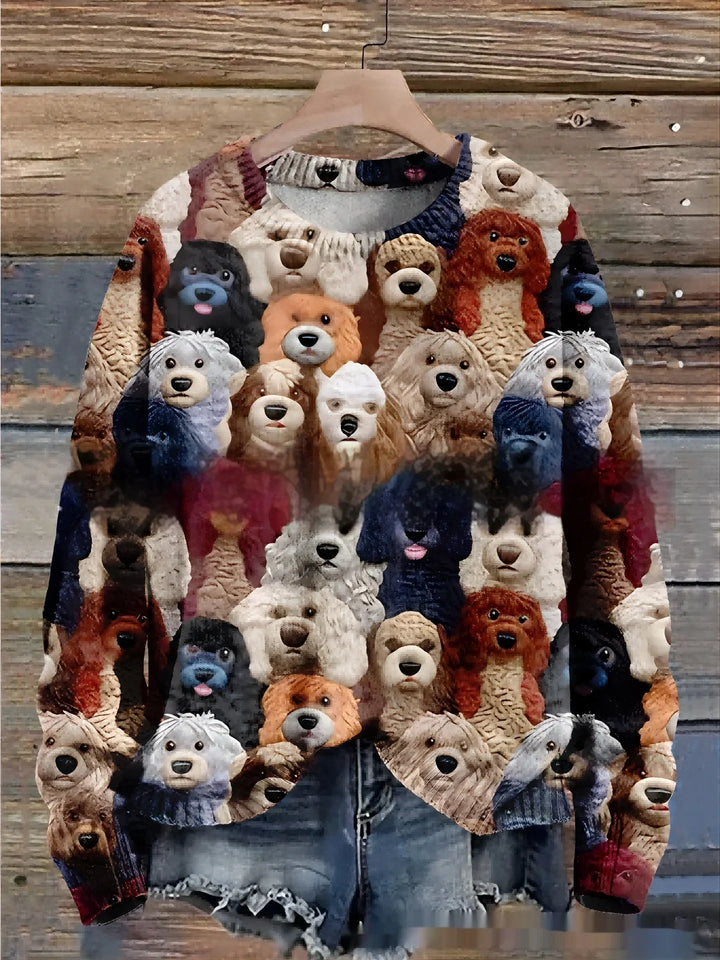 Colorful sweater with multiple cute dog faces pattern hanging on wooden background