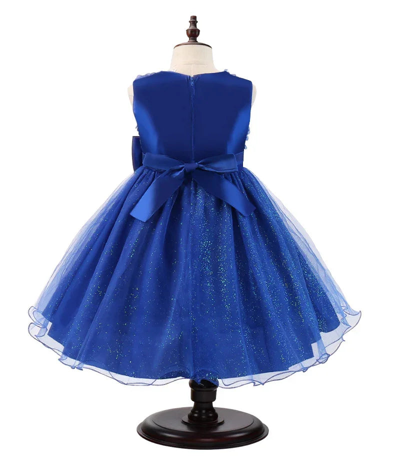 Back view of elegant blue glittery tulle dress for girls with satin bow on mannequin