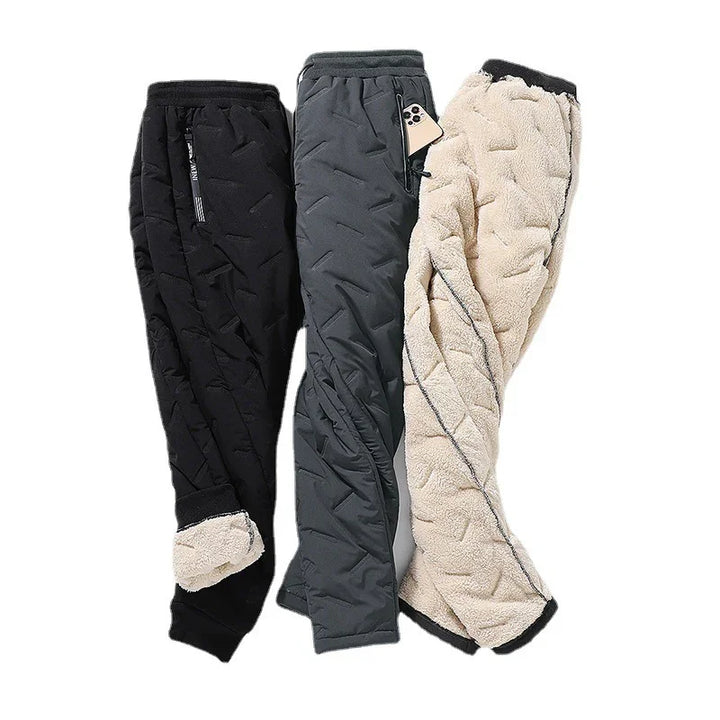 Three pairs of quilted winter pants in black, gray, and beige fleece with zipper pockets