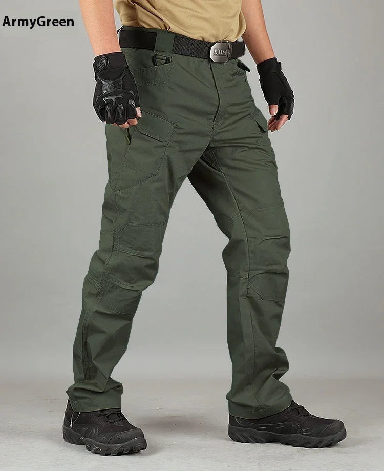 Person wearing army green tactical pants, black gloves, black belt, and black tactical boots