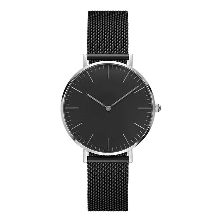 Minimalist black watch with silver case and black mesh strap on white background