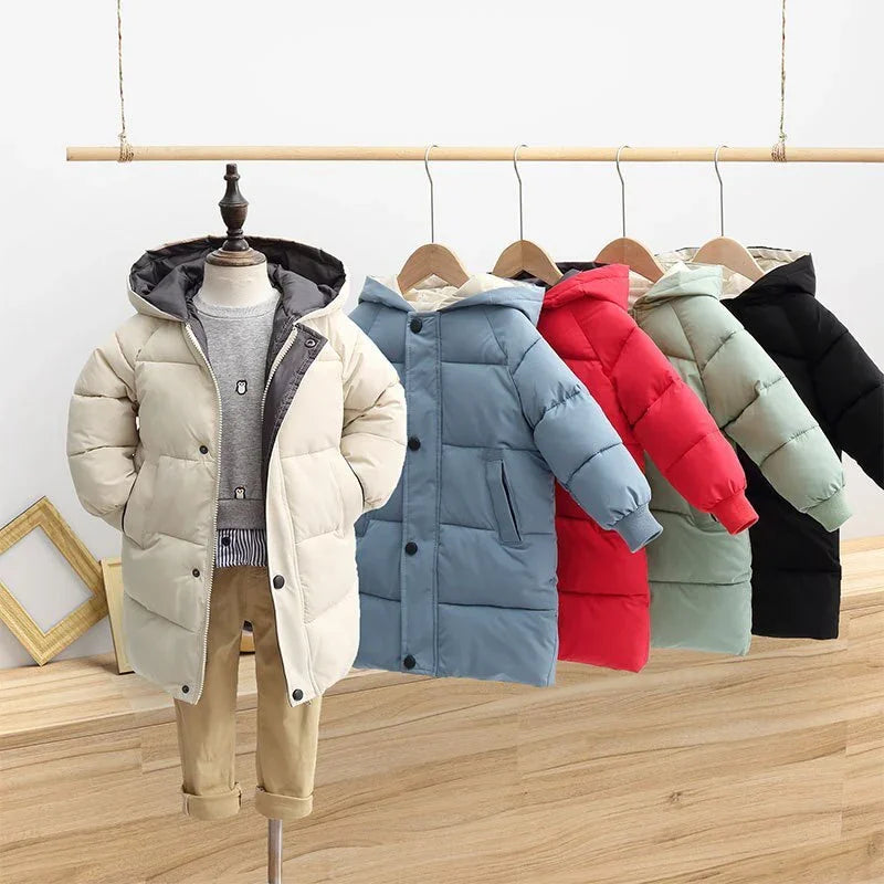 Children's padded winter coats in beige, blue, red, green, and black displayed on hangers and mannequin