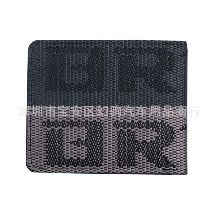black woven fabric wallet with large bold text pattern in dark and light shades