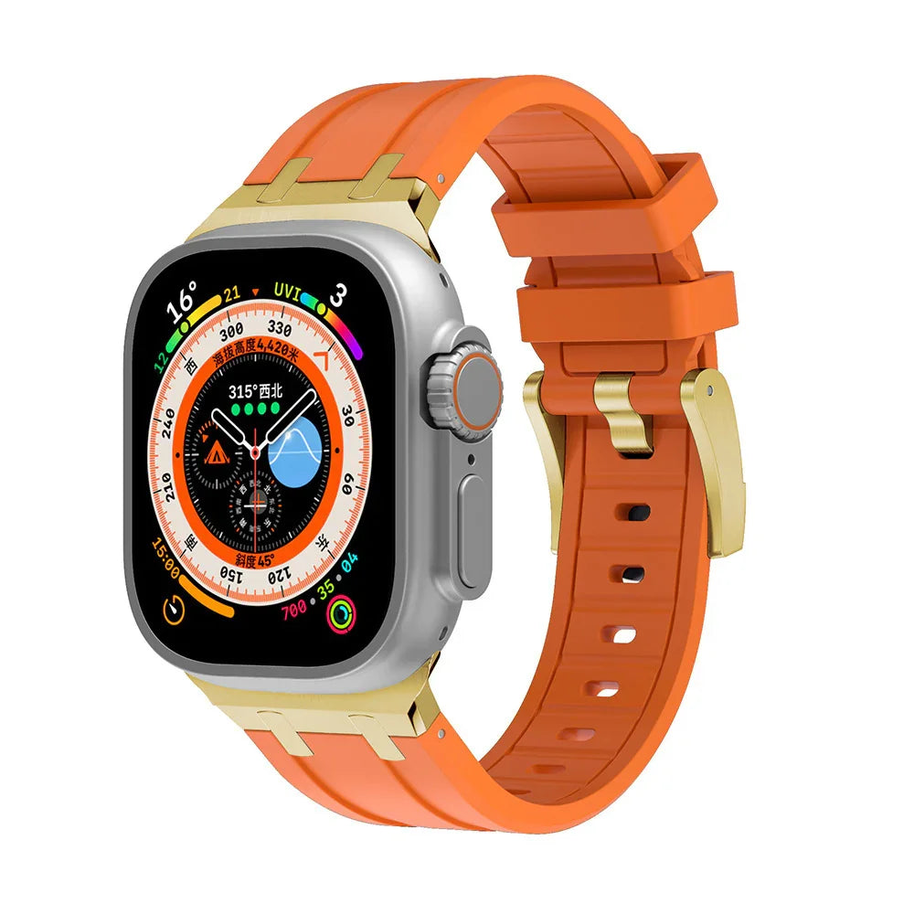 Silver smartwatch with orange rubber strap and gold buckle, displaying compass and activity data