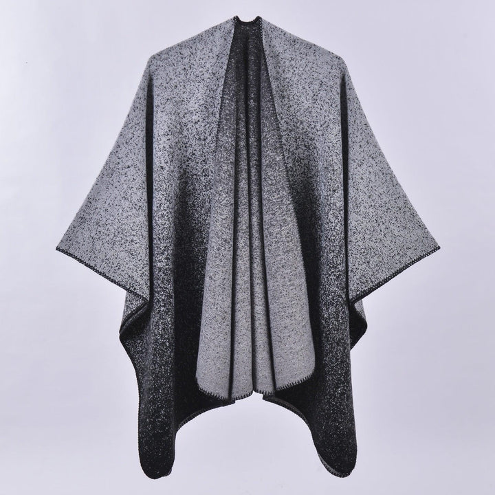 Gray and black speckled gradient wool shawl with wide sleeves, displayed against plain background