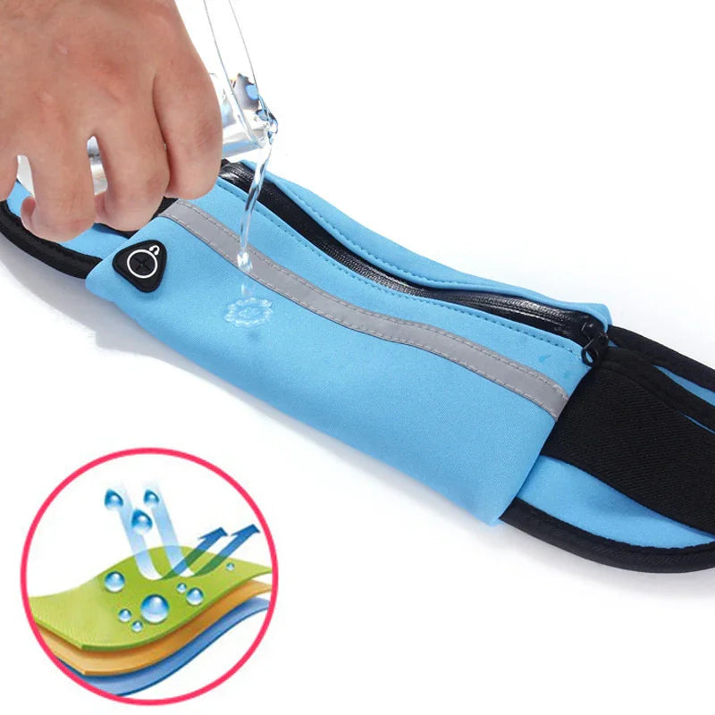 Blue waterproof running belt with zipper and earphone port, water poured on fabric to show water resistance
