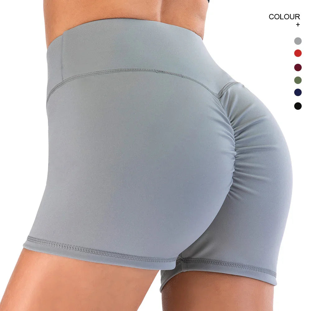 Close-up of person wearing light gray high-waisted scrunch butt yoga shorts for fitness