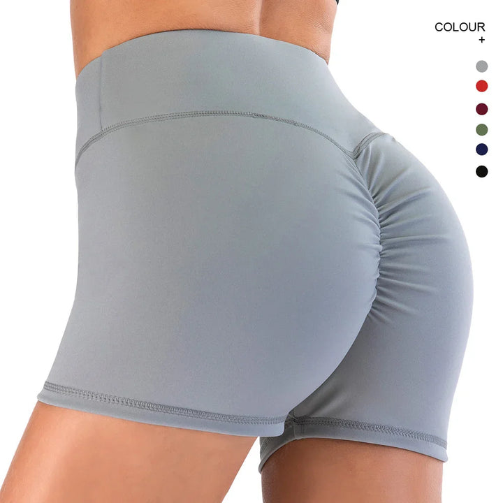 Close-up of person wearing light gray high-waisted scrunch butt yoga shorts for fitness