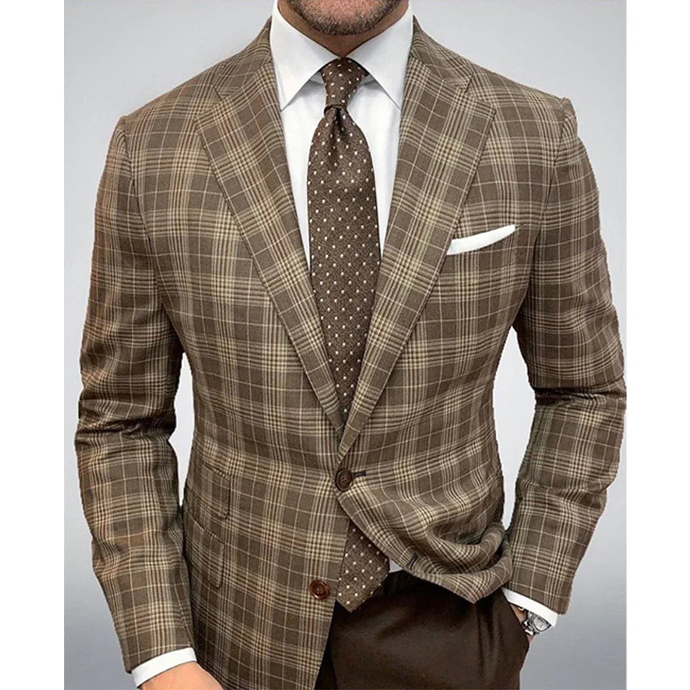 Man wearing brown plaid blazer, white dress shirt, brown polka dot tie, and white pocket square