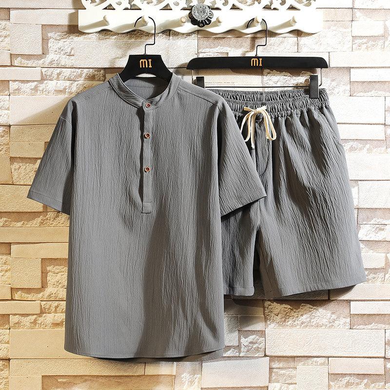 Gray men's cotton casual short-sleeve shirt and elastic waist shorts set hanging on black hangers