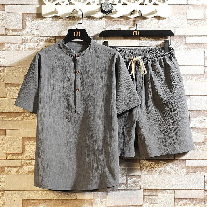 Gray men's cotton casual short-sleeve shirt and elastic waist shorts set hanging on black hangers
