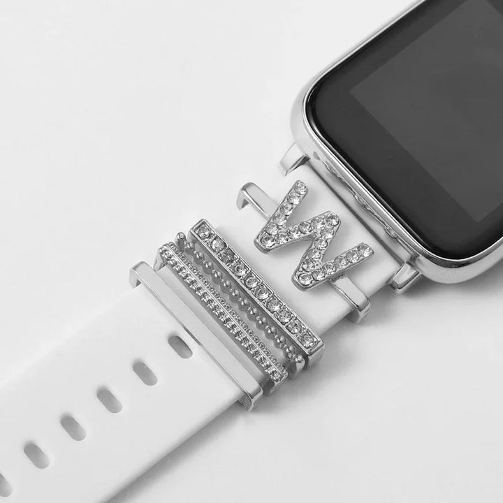 White smartwatch band with silver rhinestone letter W charm and decorative silver rings