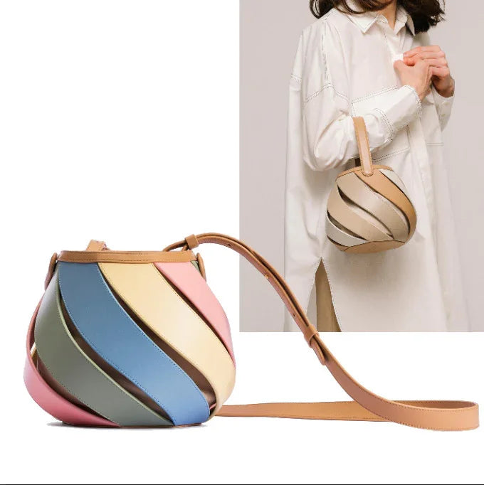 Colorful swirl pattern crossbody bag with leather strap, styled with white shirt dress
