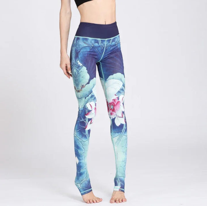 Woman wearing high-waist blue lotus flower print yoga leggings on white background