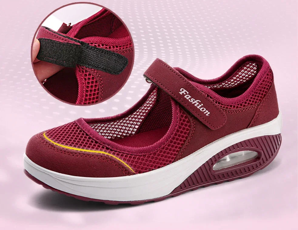 Burgundy mesh Mary Jane shoe with adjustable Velcro strap labeled Fashion, cushioned white and burgundy sole