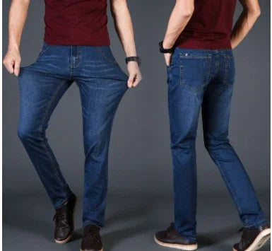 Men's stretchable slim-fit blue jeans worn with dark red t-shirt and black sneakers