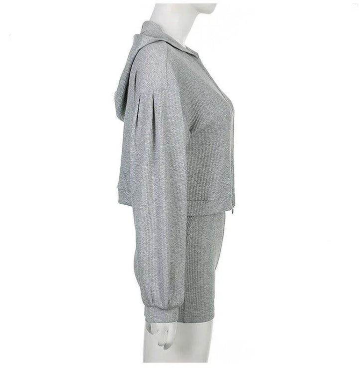 Side view of gray ribbed knit hoodie and shorts set on mannequin against white background