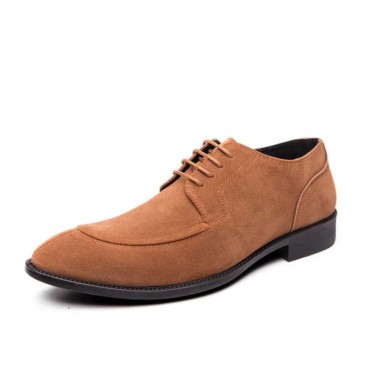 Brown suede men's dress shoe with lace-up design and black sole on white background