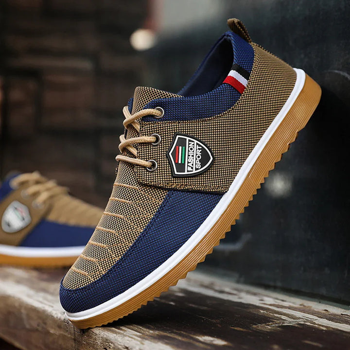 Brown and navy casual sports shoe with lace-up design and Fashion Sport logo on side