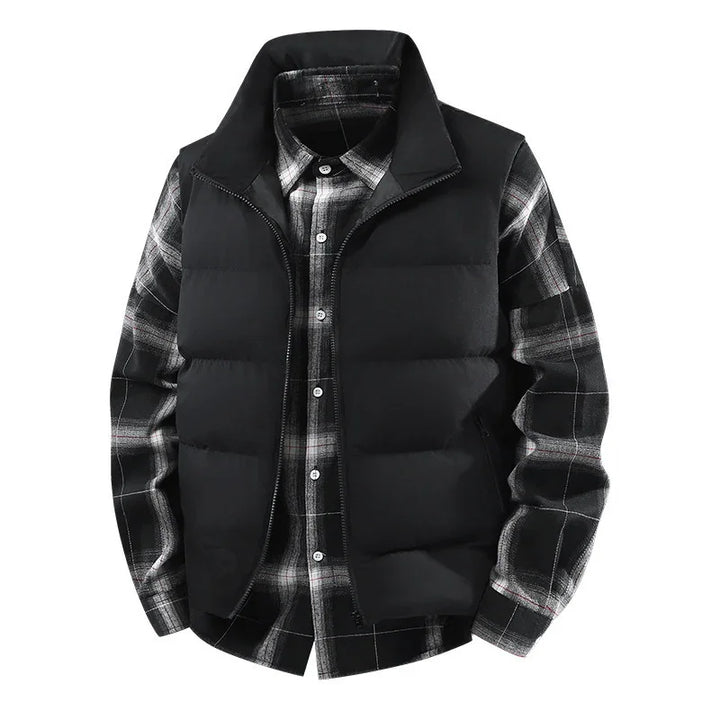 Black padded vest layered over black and white plaid button-up shirt