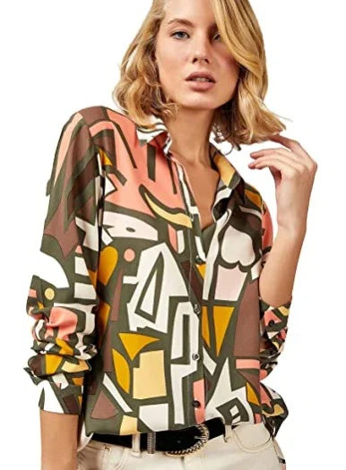 Woman wearing abstract geometric pattern shirt in brown, orange, and beige tones