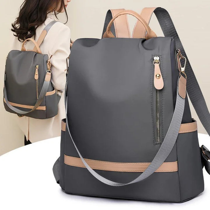 Stylish gray and beige backpack with zipper and side pockets, shown on woman and close-up