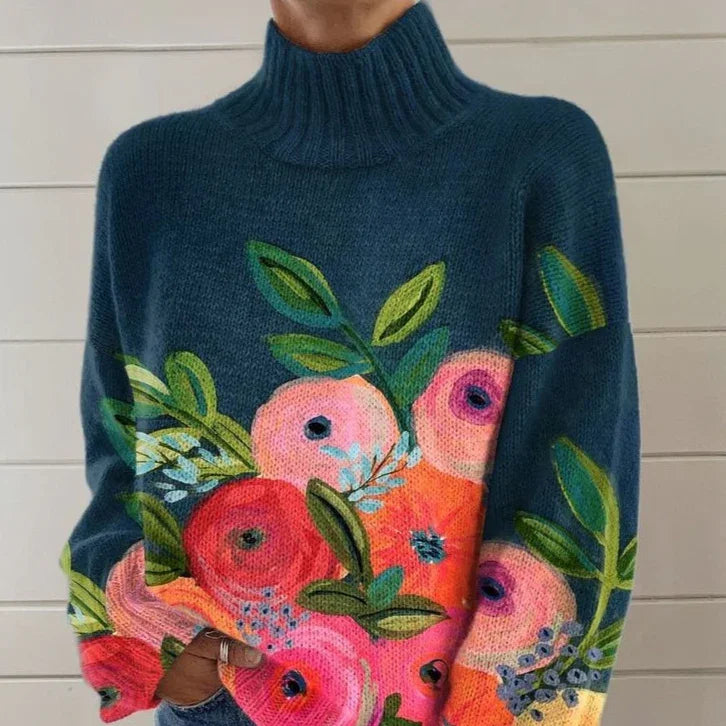Cozy dark teal turtleneck sweater with vibrant pink and red floral print and green leaves
