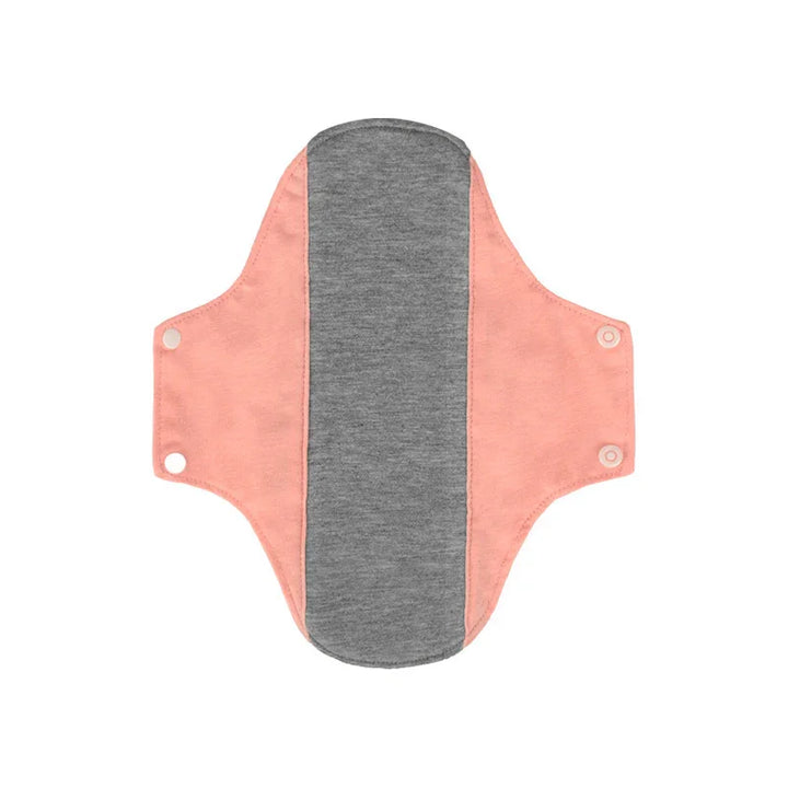 Reusable cloth menstrual pad with pink wings and gray absorbent center on white background