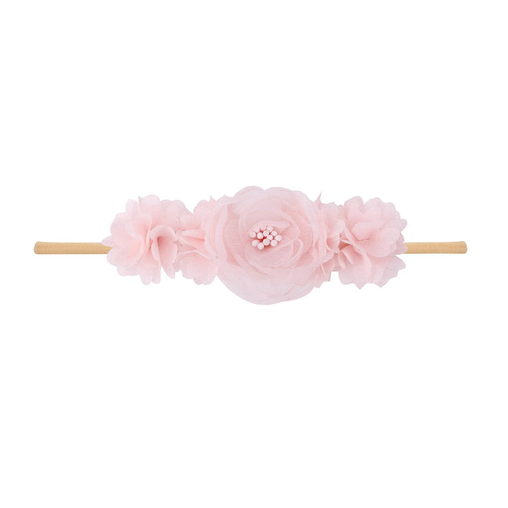 Pink fabric flower headband with layered petals on elastic band