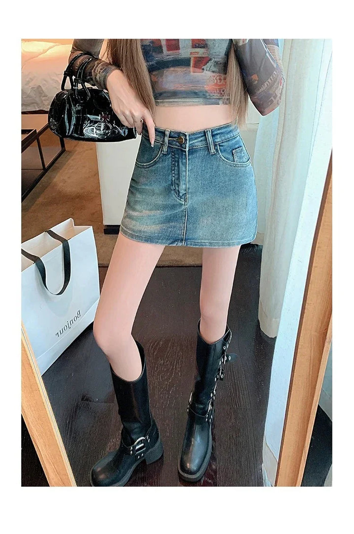 Woman wearing denim mini skirt, black knee-high boots, holding black purse indoors with shopping bag