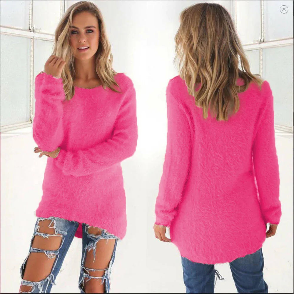 Woman wearing a fuzzy bright pink long sleeve sweater with front and back views, paired with ripped jeans