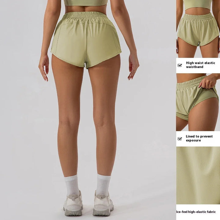 Rear view of woman wearing light green high-waist elastic waistband shorts with lining and ice-feel fabric