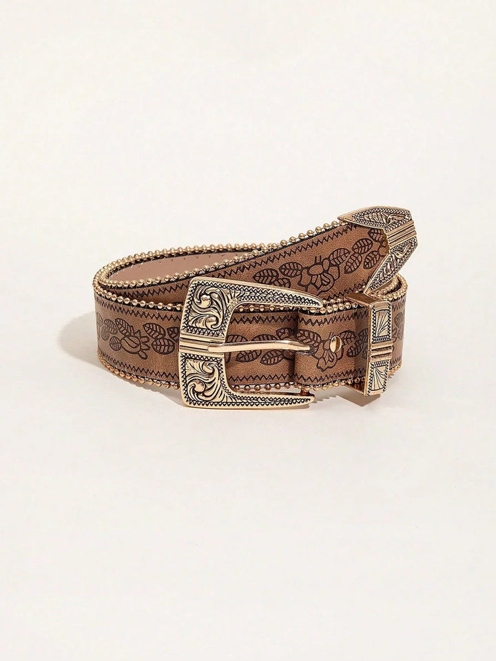 Brown leather belt with intricate floral print and decorative gold embossed buckle