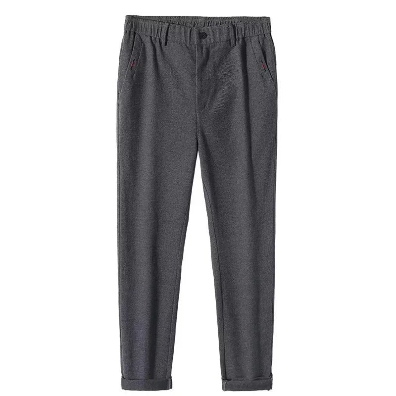 Dark gray casual trousers with elastic waistband, side pockets, button detail, and cuffed hems