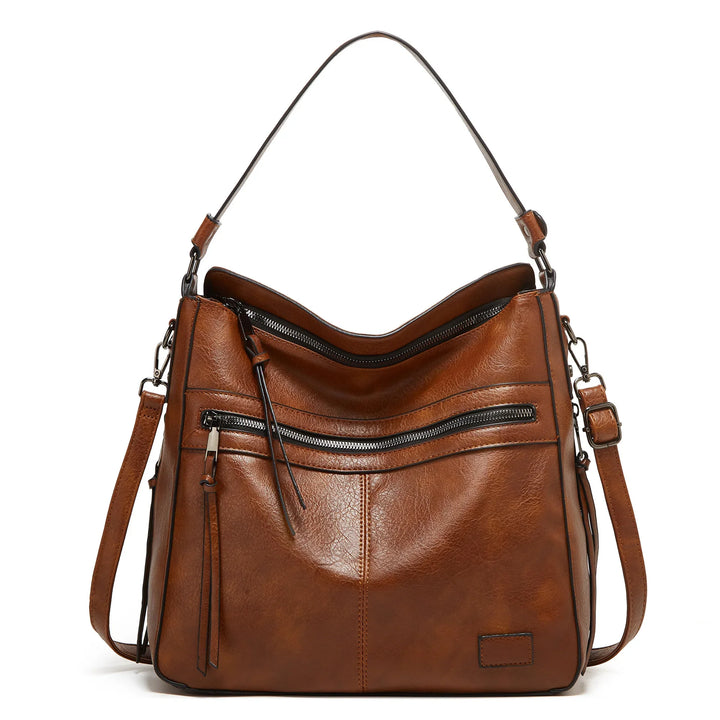 brown leather shoulder handbag with front zipper pocket and adjustable strap