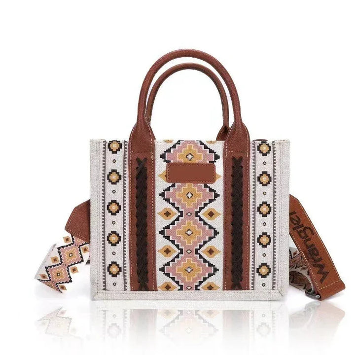 Stylish canvas tote bag with geometric tribal pattern, brown leather handles, and branded shoulder strap