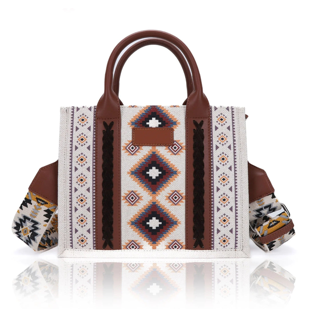 Boho-style tote bag with geometric tribal patterns and brown leather handles and accents