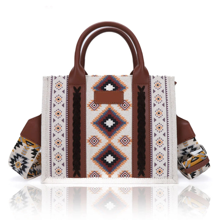 Boho-style tote bag with geometric tribal patterns and brown leather handles and accents