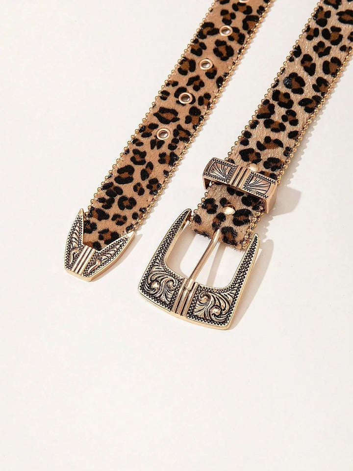 Leopard print belt with ornate gold buckle and tip on white background