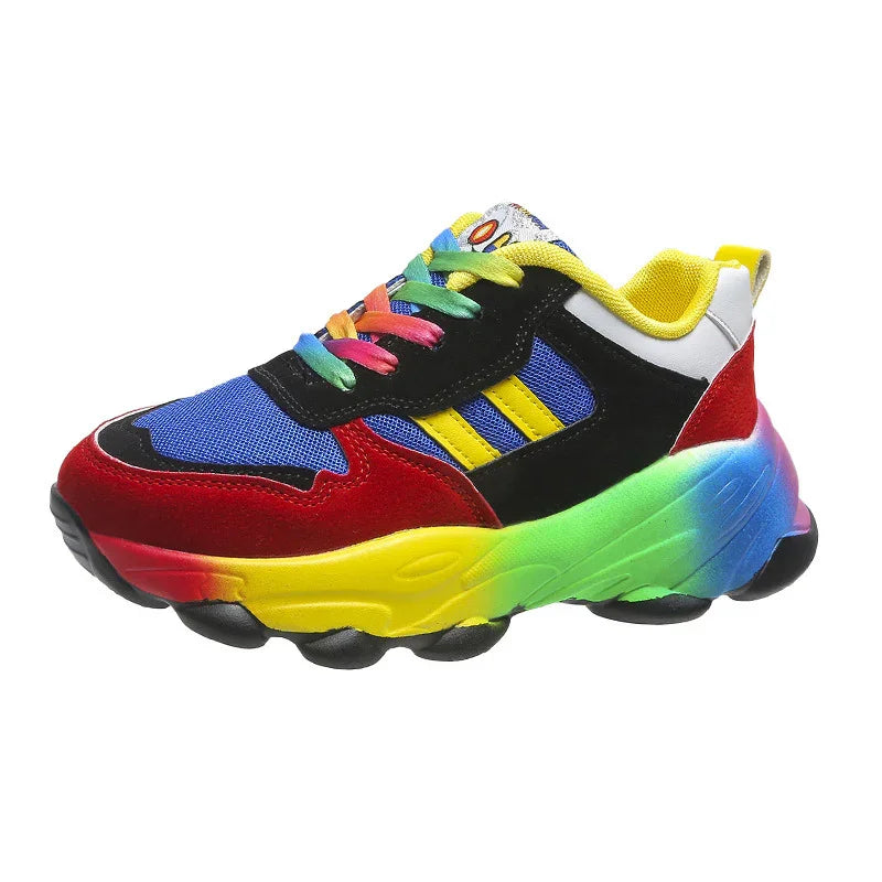 Colorful sneaker with rainbow sole, red, black, blue mesh upper, yellow stripes, and multicolor laces