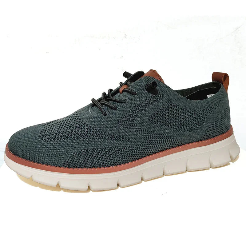 Dark gray knit casual sneaker with white sole and brown trim, lightweight breathable running shoe