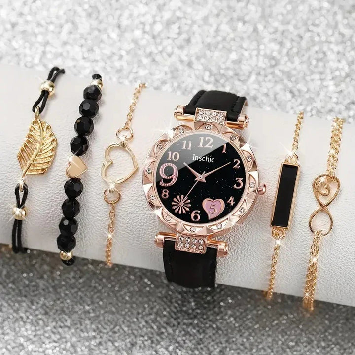 Black dial wristwatch with rose gold bezel and five gold-tone bracelets with black and heart accents