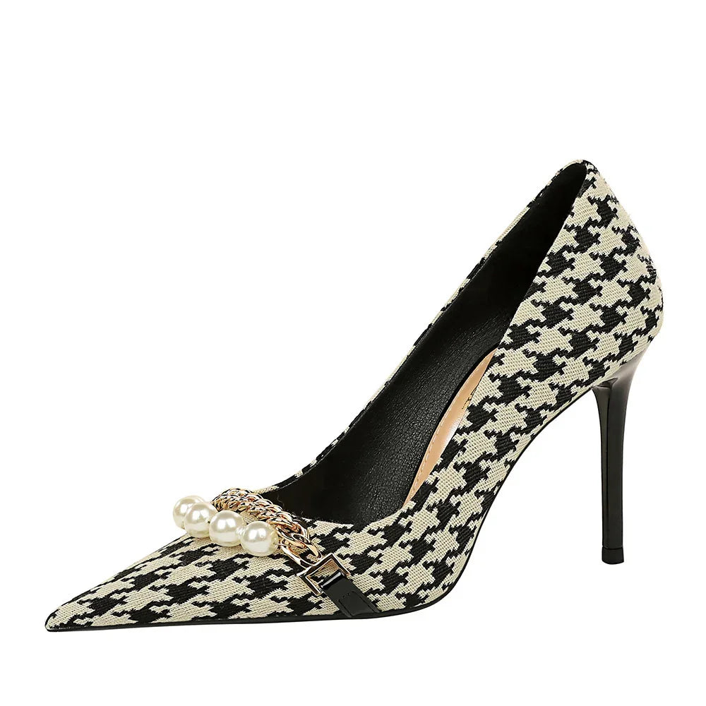 Black and white houndstooth high heel pump with pearl and gold chain embellishment