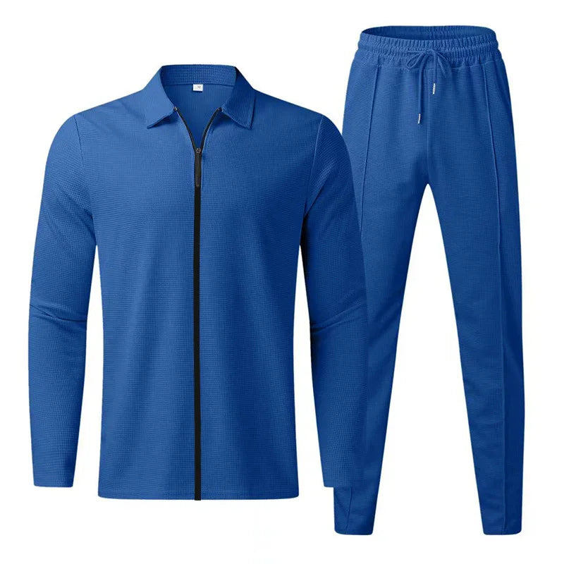 Blue men's two-piece athletic tracksuit with full-zip jacket and drawstring pants