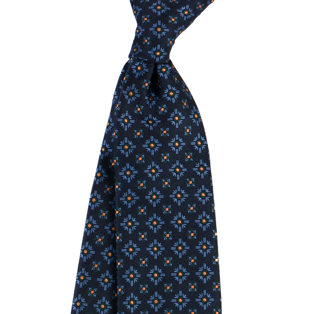 Navy blue silk tie with blue and orange geometric floral pattern