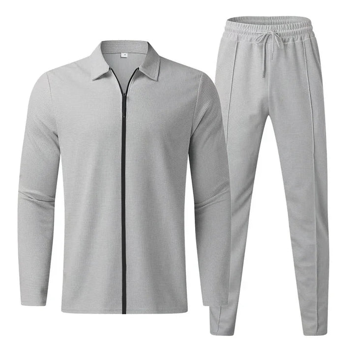 Light gray men's casual tracksuit with zip-up jacket and drawstring jogger pants